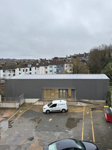New roof painting and cladding installation on commercial property