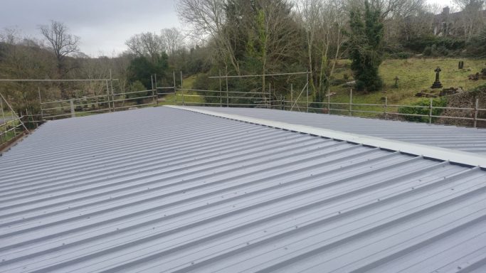 New roof painting and cladding installation on commercial property