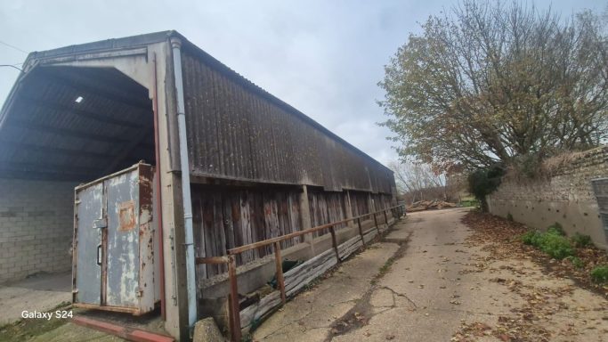 New metal roof and vertical cladding installed on agricultural building