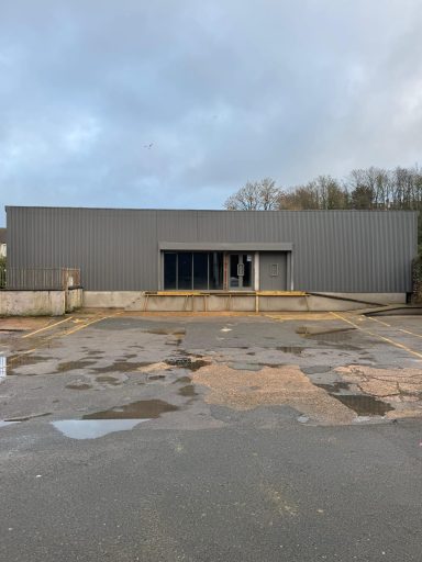 New roof painting and cladding installation on commercial property