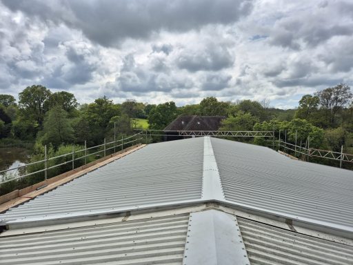 New roof painting and cladding installation on commercial property